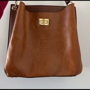 Gucci bag. It comes with a belt so you can use it like a cross body